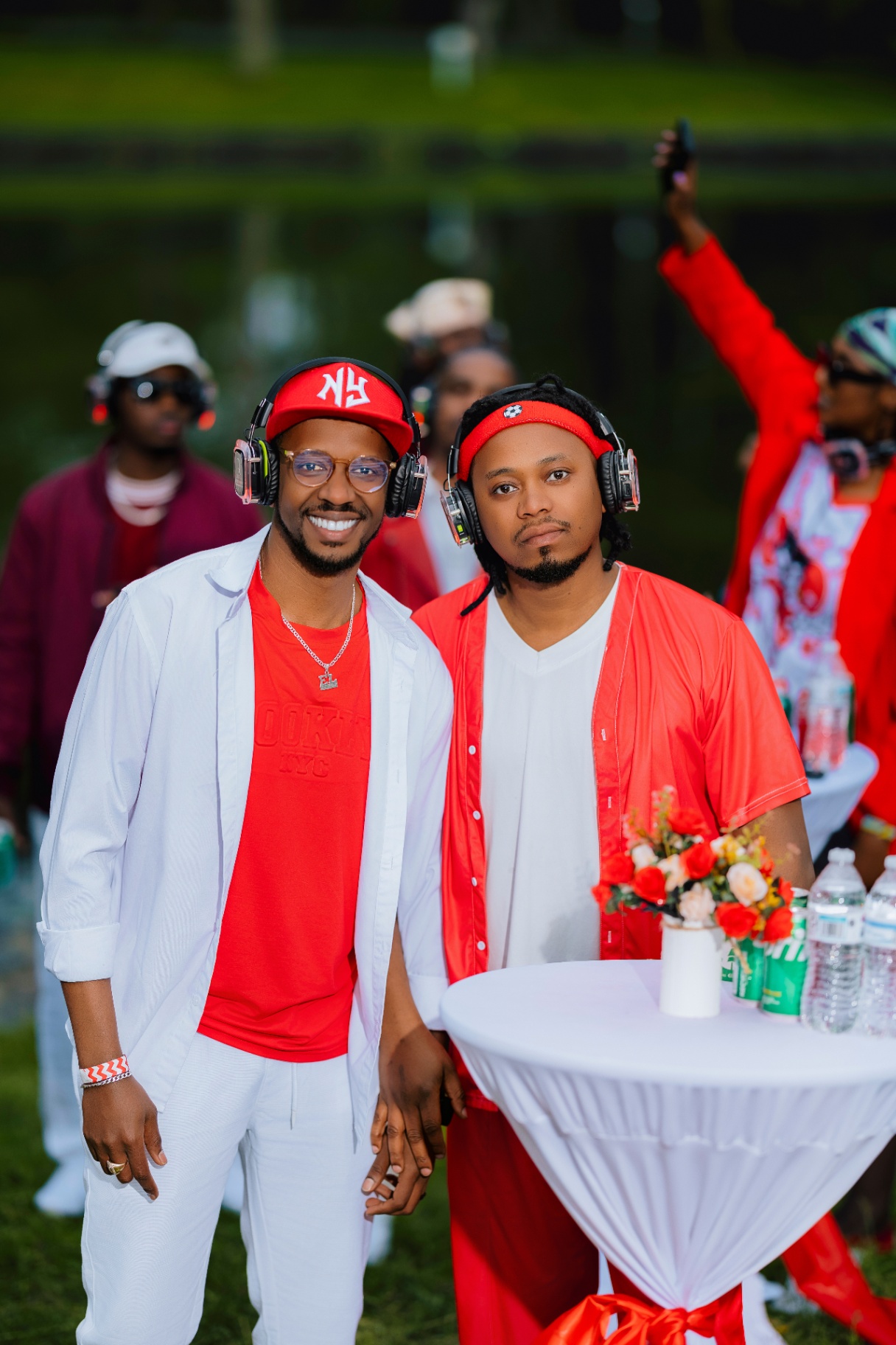 Two guys posing by the cocktail table